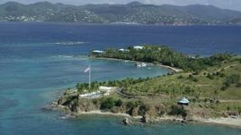 5k stock footage aerial stock footage orbit American flag and pool area on Little St James Island, St Thomas, Virgin Islands Aerial Stock Footage | AX96_161