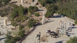 5K aerial stock footage of orbiting oil rigs on a hilltop, Santa Paula, California Aerial Stock Footage | AXSF01_012