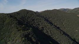 5K aerial stock footage of approaching the tree covered mountains, Santa Ynez Mountains, California Aerial Stock Footage | AXSF01_026