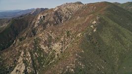5K aerial stock footage of approaching the scarred sides of mountains, Santa Ynez Mountains, California Aerial Stock Footage | AXSF01_030