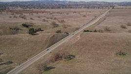 5K aerial stock footage of approaching a country highway and track a black SUV, Santa Ynez, California Aerial Stock Footage | AXSF01_049