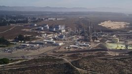 5K aerial stock footage tilt from Pismo Dunes, reveal Phillips 66 Company Santa Maria Refinery, Arroyo Grande, California Aerial Stock Footage | AXSF02_017