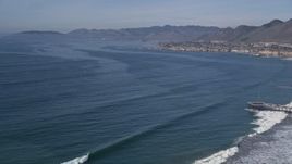 5K aerial stock footage of a coastal town seen across the bay, Pismo Beach, California Aerial Stock Footage | AXSF02_029