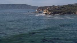 5K aerial stock footage of approaching jagged cliffs on the coast, San Luis Obispo, California Aerial Stock Footage | AXSF02_036