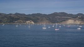 5K aerial stock footage of flying low by sailboats in San Luis Obispo Bay, Avila Beach, California Aerial Stock Footage | AXSF02_041
