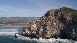 5K aerial stock footage of the Dynegy Power Plant and smoke stacks while flying around Morro Rock, Morro Bay, California Aerial Stock Footage | AXSF03_006