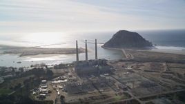 5K aerial stock footage of flying by Dynegy Power Plant and Morro Rock in Morro Bay, California Aerial Stock Footage | AXSF03_009