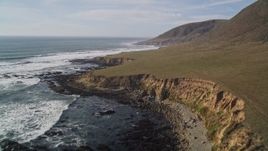 5K aerial stock footage of flying over a hill to follow the coastline, Harmony, California Aerial Stock Footage | AXSF03_018