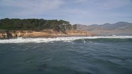 5K aerial stock footage of approaching the coastline from the Pacific Ocean, San Simeon, California Aerial Stock Footage | AXSF03_044