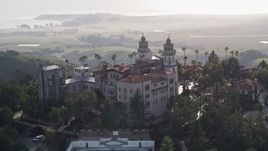 5K aerial stock footage of flying by the east and north side of historic Hearst Castle, San Simeon, California Aerial Stock Footage | AXSF03_049