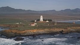 5K aerial stock footage of passing by Point Piedras Blancas lighthouse, San Simeon, California Aerial Stock Footage | AXSF03_056