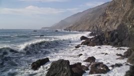 5K aerial stock footage Fly low over ocean waves, rocks, by coastal cliffs, San Simeon, California Aerial Stock Footage | AXSF03_064