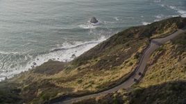 5K aerial stock footage of flying by Highway 1 coastal road above cliffs, Big Sur, California Aerial Stock Footage | AXSF03_068