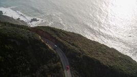 5K aerial stock footage track white convertible on Highway 1, above coastal cliffs, Big Sur, California Aerial Stock Footage | AXSF03_069