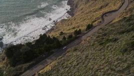 5K aerial stock footage bird's eye view of Highway 1 winding along hills above the coast, Big Sur, California Aerial Stock Footage | AXSF03_070