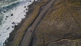 5K aerial stock footage of tracking a car traveling on Highway 1 along the coast, Big Sur, California Aerial Stock Footage | AXSF03_074