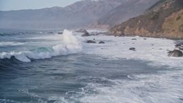 5K aerial stock footage of flying over tall waves, approaching coastal rock formations, Big Sur, California Aerial Stock Footage | AXSF03_084