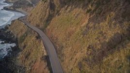 5K aerial stock footage of flying over coastal cliffs, revealing Highway 1 coastal road, Big Sur, California Aerial Stock Footage | AXSF03_086