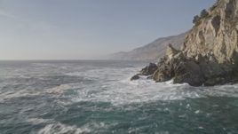 5K aerial stock footage of flying by coastal cliffs and over rock formations, Big Sur, California Aerial Stock Footage | AXSF03_096