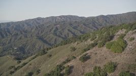 5K aerial stock footage of flying over green mountains in Los Padres National Forest, California Aerial Stock Footage | AXSF03_111