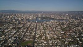 5K aerial stock footage of flying over urban neighborhoods toward Lake Merritt, Downtown Oakland, California Aerial Stock Footage | AXSF05_001