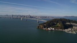 5K aerial stock footage flying by Yerba Buena Island, with a view of the Bay Bridge, San Francisco, California Aerial Stock Footage | AXSF05_007