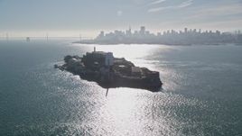 5K aerial stock footage of iconic Alcatraz, reveal city skyline and Bay Bridge, San Francisco, California Aerial Stock Footage | AXSF05_021
