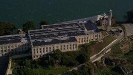 5K aerial stock footage orbit main building and lighthouse on Alcatraz in San Francisco, California Aerial Stock Footage | AXSF05_024