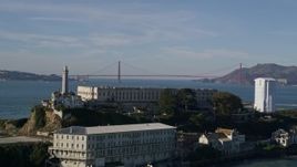 5K aerial stock footage flyby Alcatraz and reveal Golden Gate Bridge in the far distance, San Francisco, California Aerial Stock Footage | AXSF05_025