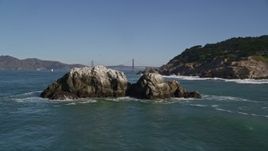 5K aerial stock footage approach Seal Rocks, reveal the Golden Gate Bridge, San Francisco, California Aerial Stock Footage | AXSF05_056