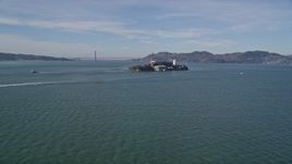 5K aerial stock footage of iconic Alcatraz with a view of the famous Golden Gate Bridge, San Francisco, California Aerial Stock Footage | AXSF05_066