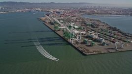 5K aerial stock footage approach and fly over large cargo cranes at the Port of Oakland, California Aerial Stock Footage | AXSF05_079