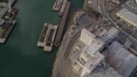 5K aerial stock footage of waterfront warehouses and factories, reveal Union Point Park, Oakland Estuary, California Aerial Stock Footage | AXSF06_003