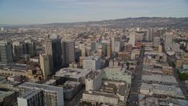 5K aerial stock footage of tilting from the freeway to reveal office buildings, city hall, I-980 in Downtown Oakland, California Aerial Stock Footage | AXSF06_006