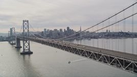 5K aerial stock footage track light Bay Bridge traffic with views of the skyline, San Francisco, California Aerial Stock Footage | AXSF06_013