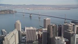 5K aerial stock footage of a bird's eye view of California Street in the city's Chinatown district, tilt to reveal Bay Bridge, San Francisco, California Aerial Stock Footage | AXSF06_022