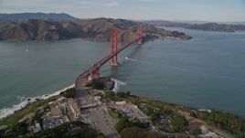 5K aerial stock footage fly over The Presidio and freeway toll booth, reveal Golden Gate Bridge, San Francisco, California Aerial Stock Footage | AXSF06_042