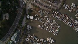 5K aerial stock footage bird's eye view of a marina on Richardson Bay, Highway 101 freeway and strip mall, Sausalito, California Aerial Stock Footage | AXSF06_049