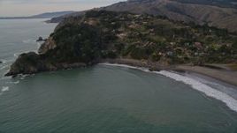 5K aerial stock footage of flying by hillside homes on coastal cliffs in Muir Beach, Marin County, California Aerial Stock Footage | AXSF06_051