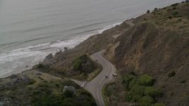 5K aerial stock footage of tracking a silver convertible traveling on Highway 1, Marin County, California Aerial Stock Footage | AXSF06_056