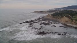 5K aerial stock footage of flying by ocean waves near coastal cliffs, Bolinas, California Aerial Stock Footage | AXSF06_058
