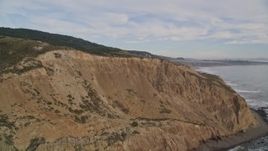 5K aerial stock footage of panning across coastal cliffs toward the ocean, then veer back toward the coast, Bolinas, California Aerial Stock Footage | AXSF06_064