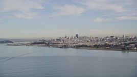 5K aerial stock footage flying low over the bay and ascending toward Downtown San Francisco skyline, California Aerial Stock Footage | AXSF06_077