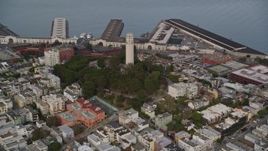 5K aerial stock footage tilt from North Beach apartments, reveal Coit Tower and piers, San Francisco, California Aerial Stock Footage | AXSF06_083