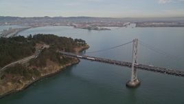 5K aerial stock footage approach the Bay Bridge and tilt to reveal Coast Guard Station on Yerba Buena Island, San Francisco, California Aerial Stock Footage | AXSF06_087