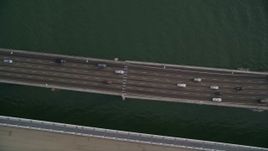 5K aerial stock footage of a bird's eye view of traffic crossing the upper deck of Bay Bridge, San Francisco, California Aerial Stock Footage | AXSF06_089