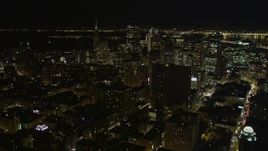 5K aerial stock footage tilt up to reveal high-rises and skyscrapers in Downtown San Francisco, California, night Aerial Stock Footage | AXSF07_012