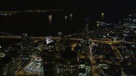 5K aerial stock footage of flying over skyscrapers to approach the bay, Downtown San Francisco, California, night Aerial Stock Footage | AXSF07_020