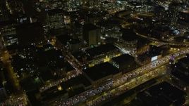 5K aerial stock footage tilt from I-80 freeway to reveal skyscrapers in Downtown San Francisco, California, night Aerial Stock Footage | AXSF07_022