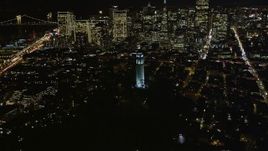 5K aerial stock footage flyby Coit Tower in North Beach, San Francisco, California, night Aerial Stock Footage | AXSF07_025